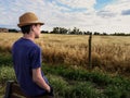 Boy with hat looking at the horizon Royalty Free Stock Photo