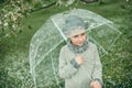 Boy in a hat with an umbrella Royalty Free Stock Photo