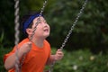 boy have a ride on a swing Royalty Free Stock Photo