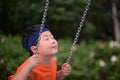 boy have a ride on a swing Royalty Free Stock Photo