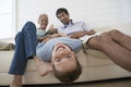 Boy Having Fun With Father And Grandfather On Sofa Royalty Free Stock Photo