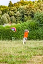 Boy having fun flying a kite in summer Royalty Free Stock Photo