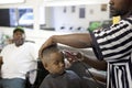A boy having a haircut, Mississippi Royalty Free Stock Photo