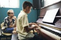 Boy having a piano lesson at music school Royalty Free Stock Photo