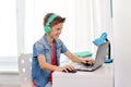 Boy in headphones playing video game on laptop Royalty Free Stock Photo