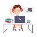 Boy in Headphones Studying Online Using Computer and Raising His Hand to Answer, Distance Lesson, Homeschooling Concept Royalty Free Stock Photo