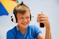 Boy in headphones with your smartphone outdoors