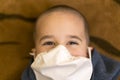 Boy Health mask to filter dust and germs , illness prevention , health care concept. 5 years old boy in medicine healthcare mask Royalty Free Stock Photo