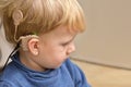 Boy With A Hearing Aids And Cochlear Implants Royalty Free Stock Photo