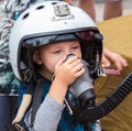 Boy in helmet pilot on annual military exhibition Russian Army 2018 on Central Uglovoe Aerodrome.