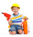 Boy in a helmet plays in the builder Royalty Free Stock Photo