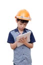 Boy with helmet wrting something on notebook Royalty Free Stock Photo