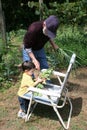 Boy Helping Grandpa In The Garden Royalty Free Stock Photo