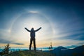 The boy hiker standing with raised hands on a top of mountain Royalty Free Stock Photo