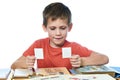 Boy with his collection of old postage stamps isolated Royalty Free Stock Photo