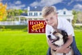 Boy and His Dog in Front of Sold Sign, House Royalty Free Stock Photo