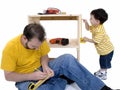 Boy And His Father Building A Storage Cabinet Together Royalty Free Stock Photo