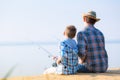 Boy and his father fishing togethe