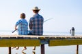 Boy and his father fishing togethe