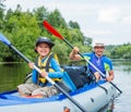 Boy with his father kayaking