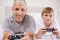Boy and his father playing video games Royalty Free Stock Photo