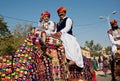 Boy and his father rides the camel