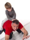 A boy on his fathers back, parenting can be diffic Royalty Free Stock Photo