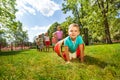 Boy and his friends crawling through the tube Royalty Free Stock Photo