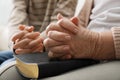 Boy and his godparent praying together, closeup