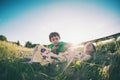 The boy and his mother are lying in the meadow Royalty Free Stock Photo