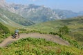 Boy on his mountain bike going down the path from Jochpass Royalty Free Stock Photo