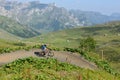 Boy on his mountain bike going down the path from Jochpass Royalty Free Stock Photo