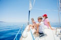 Boy with his sister and mother on board of sailing yacht on summer cruise. Royalty Free Stock Photo