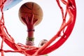 Boy hitting a basketball, seen from below Royalty Free Stock Photo