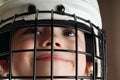 Boy in hockey helmet