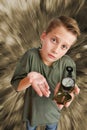 Boy hold a compass on monochrome background Royalty Free Stock Photo