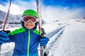 Close smiling portrait of a boy with ski on slope Royalty Free Stock Photo