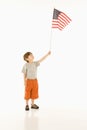 Boy holding American flag. Royalty Free Stock Photo