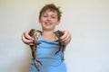 Boy holding a big toad in his hands. two frogs Royalty Free Stock Photo