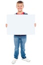 Boy holding blank whiteboard