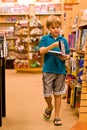 Boy holding book and walking Royalty Free Stock Photo