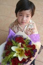 Boy holding bouquet