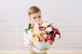 Boy holding a bucket with flowers Royalty Free Stock Photo