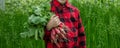 the boy is holding a bunch of freshly picked radishes Royalty Free Stock Photo