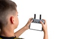 Boy holding a drone controller with blank screen, ideal for UI mockups, app design previews, or technology product presentations Royalty Free Stock Photo