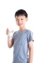 Boy holding a glass of milk over white background