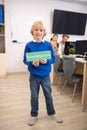 Boy holding green sign with word knowledgeable Royalty Free Stock Photo