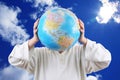 Boy holding with hands a globe in place of head Royalty Free Stock Photo