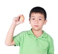 Boy holding hen egg in hand on white background isolated Royalty Free Stock Photo