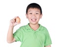 Boy holding hen egg in hand on white background isolated Royalty Free Stock Photo